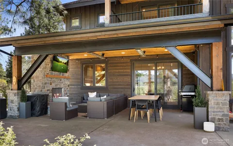 a view of a patio with table and chairs and potted plants