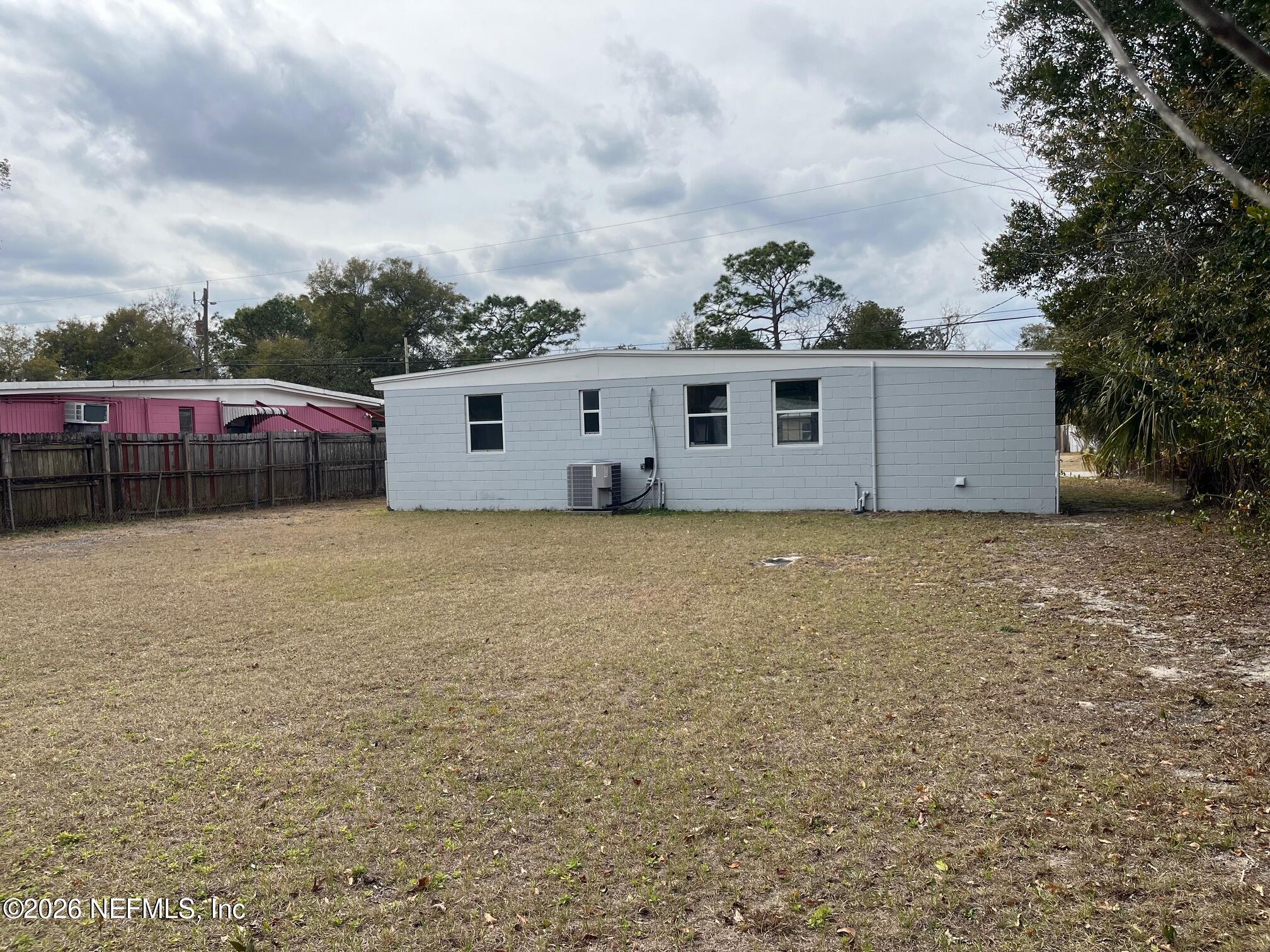 10547 Briarcliff Road East Jacksonville, FL 32218 - Photo 25 of 33 a view of a house with a yard