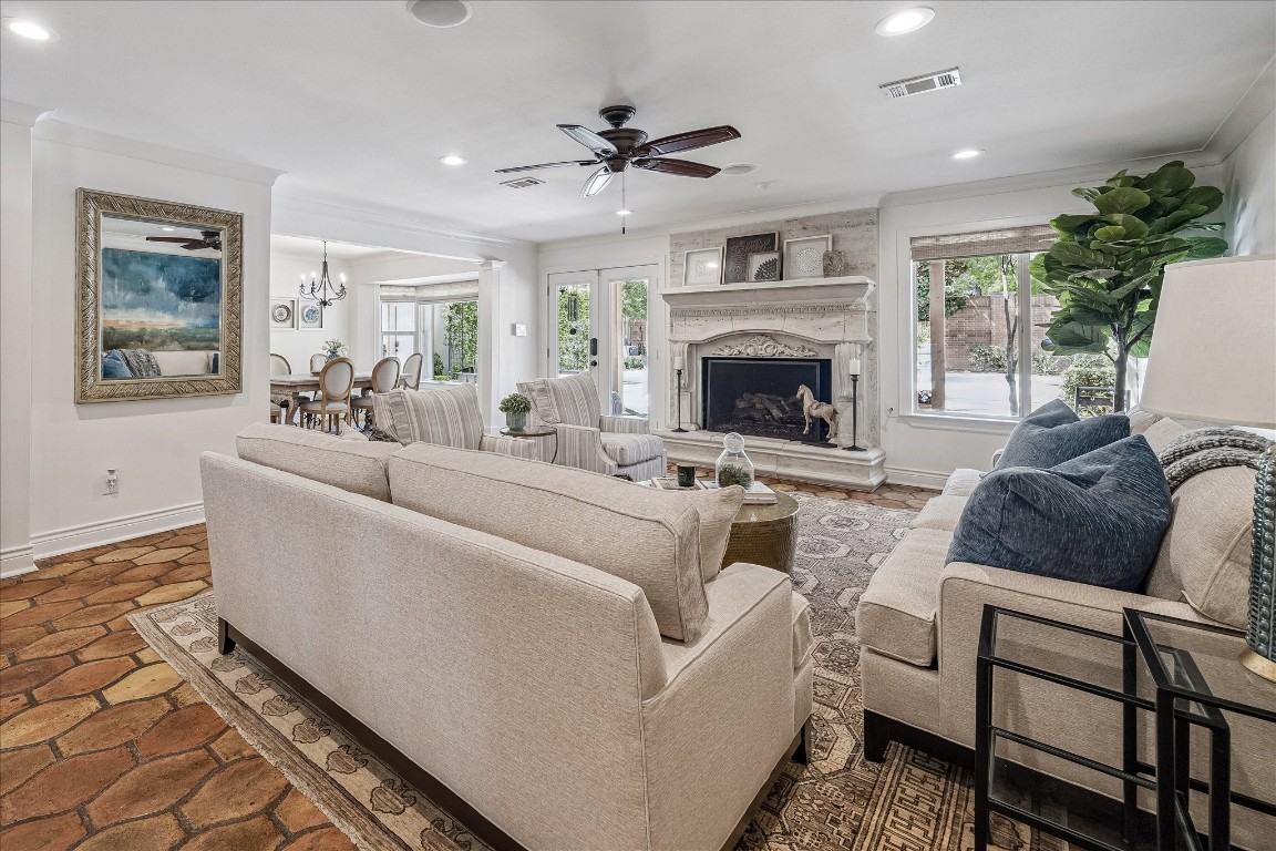 627 Ramblewood Road Houston, TX 77079 - Photo 17 of 48 French doors and a large window flank the fireplace allowing for tons of light. Beautiful gas fireplace.