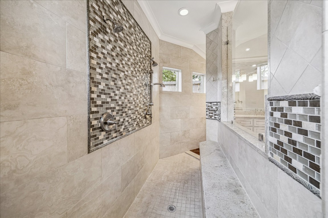 627 Ramblewood Road Houston, TX 77079 - Photo 21 of 48 Look at the size of this walk through shower, complete with built in bench and dual shower heads.