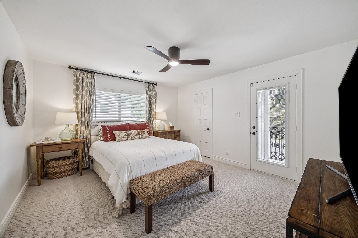 627 Ramblewood Road Houston, TX 77079 - Photo 24 of 48 secondary bedroom with new carpet, paint and ceiling fan and balcony access.