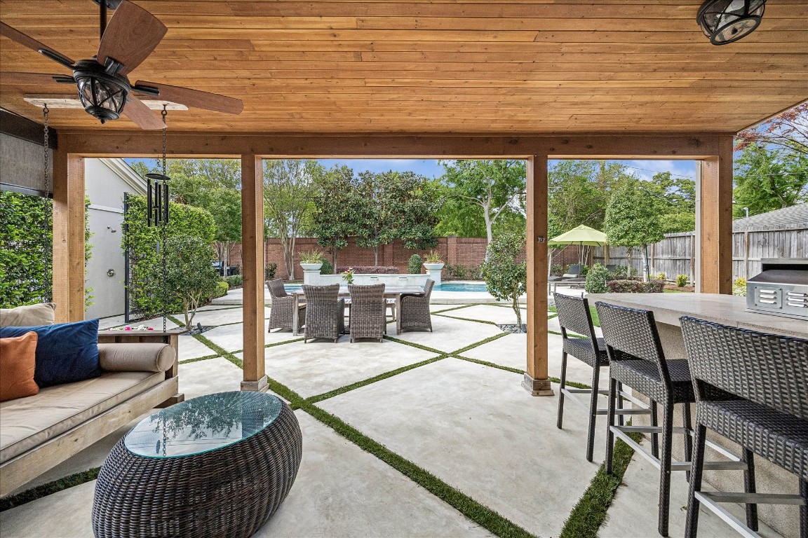 627 Ramblewood Road Houston, TX 77079 - Photo 35 of 48 Covered patio, built in grill, swinging chair and remote sun shade for total relaxation.
