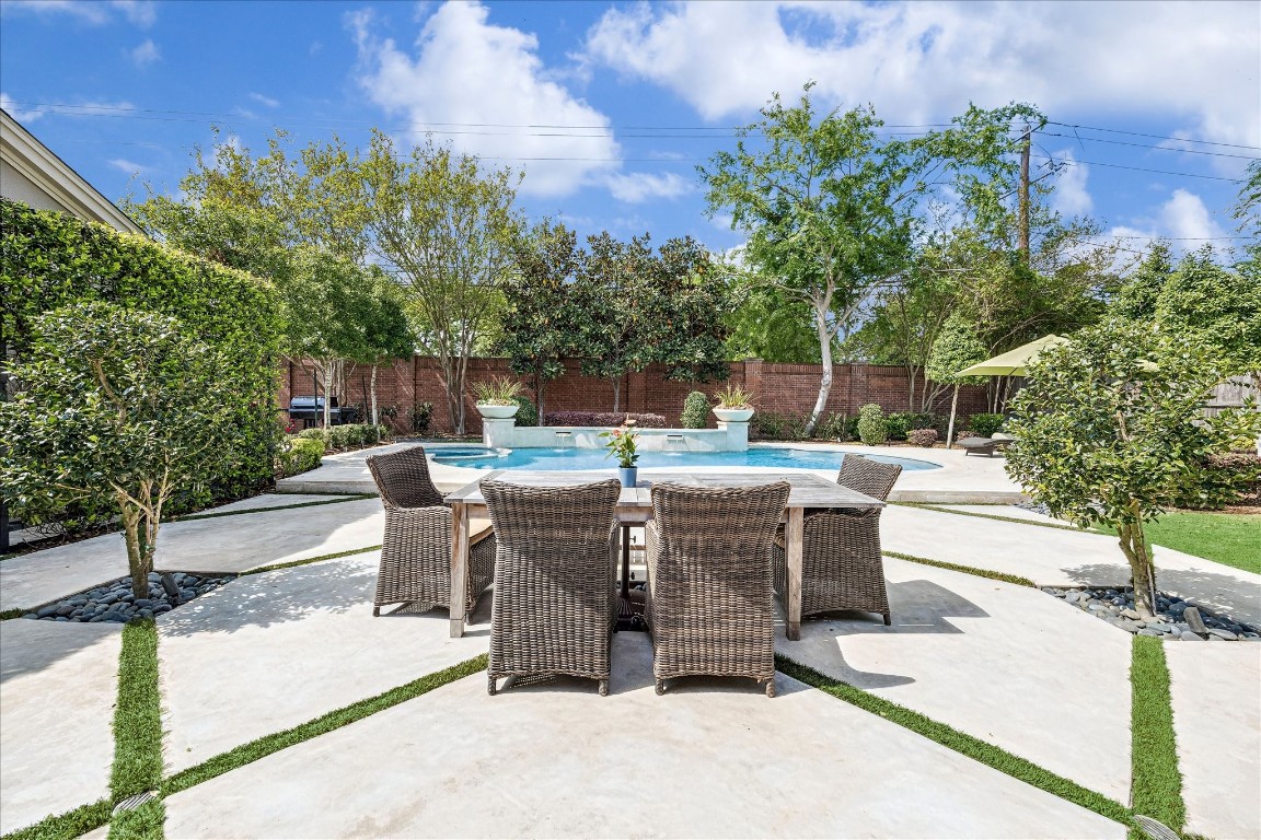 627 Ramblewood Road Houston, TX 77079 - Photo 36 of 48 Stunning backyard with professional landscaping. Turf and drainage addded between pavers. Wall of jasmine is to your left, along with an outdoor shower and a pool bath. Talk about the ultimate in outdoor living.