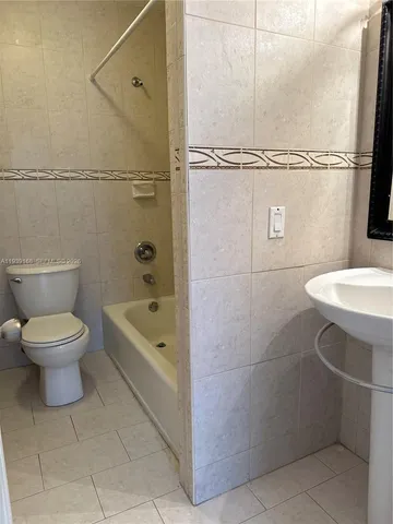 a bathroom with a toilet sink and a bathtub
