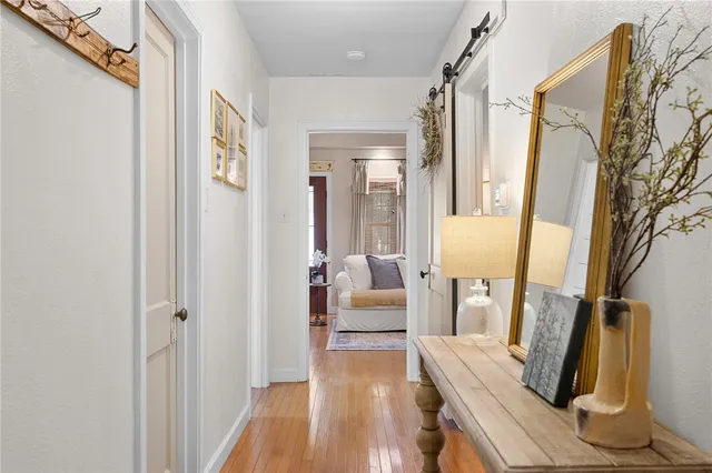 a spacious bedroom with a bed and a dresser