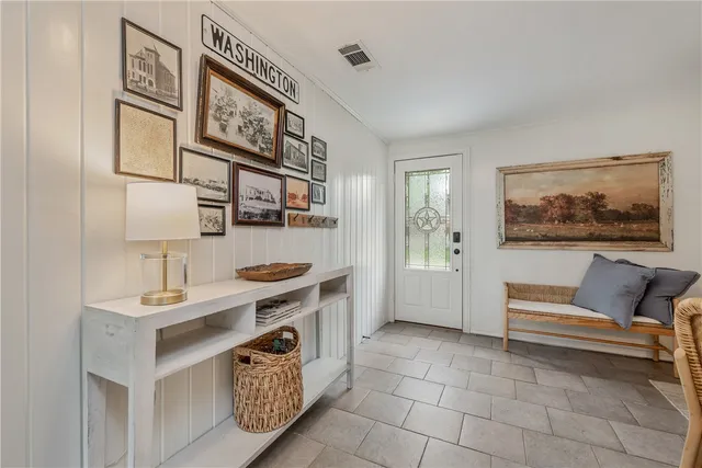 a work room with furniture and a window