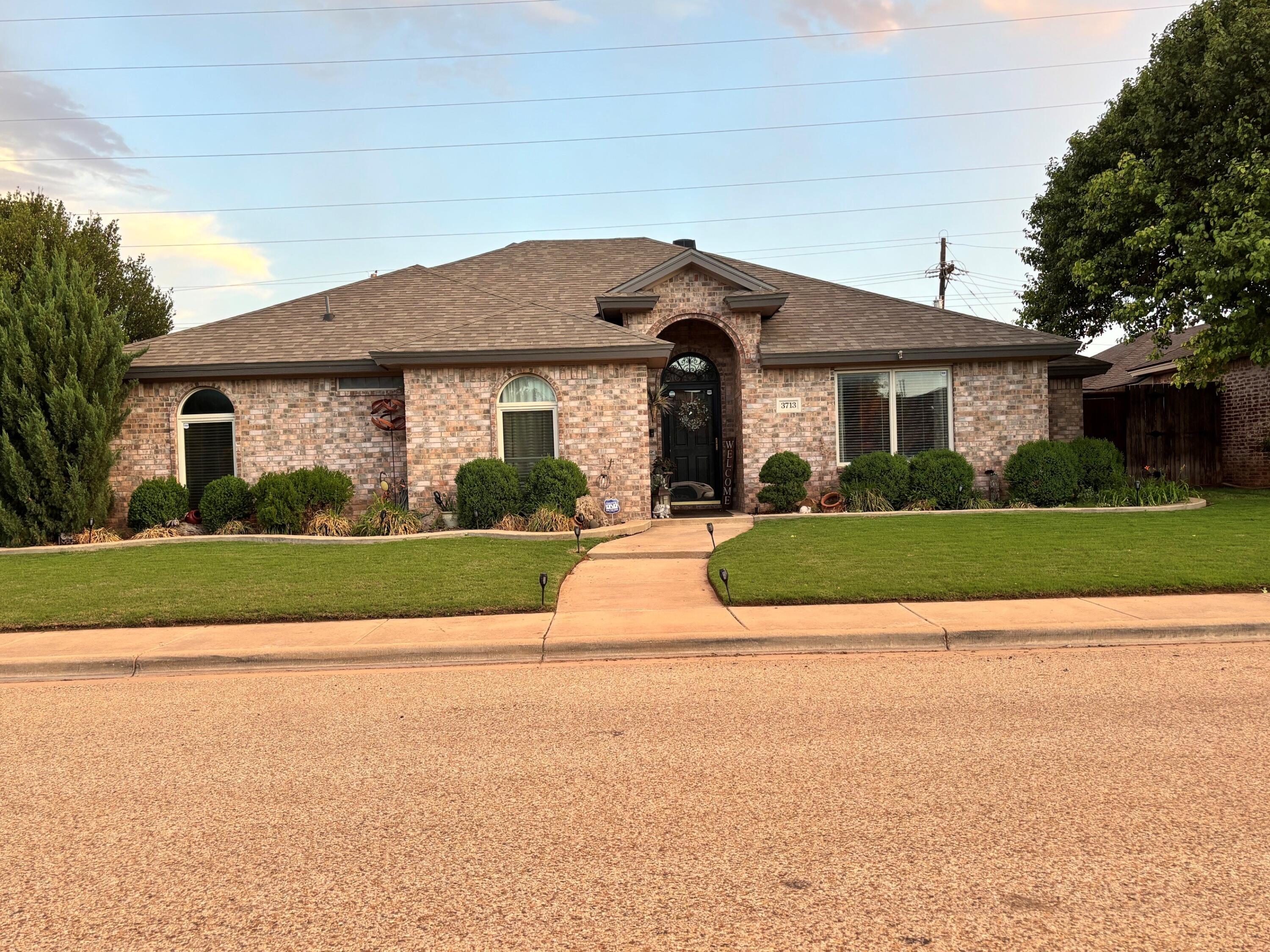 3713 106th Street Lubbock, TX 79423 - Photo 1 of 22 a view of house with yard