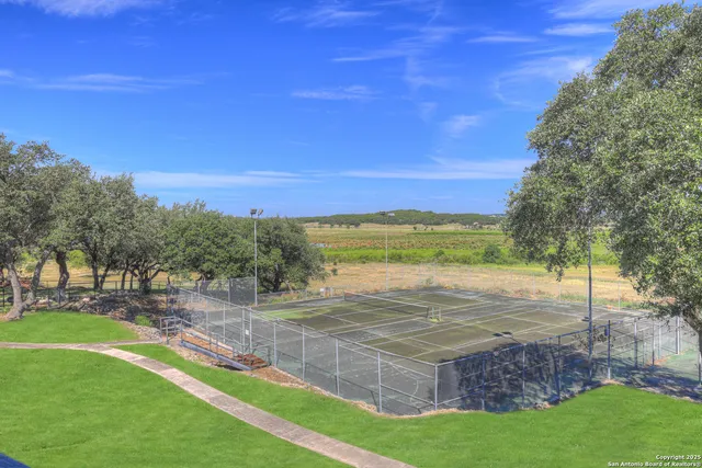 an aerial view of a house with outdoor space