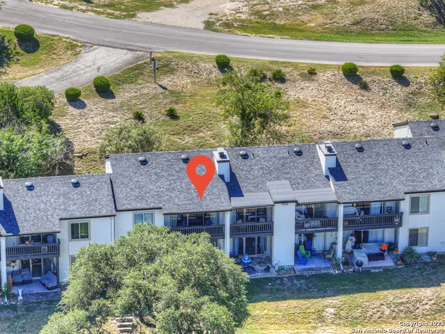 a aerial view of a house with a swimming pool