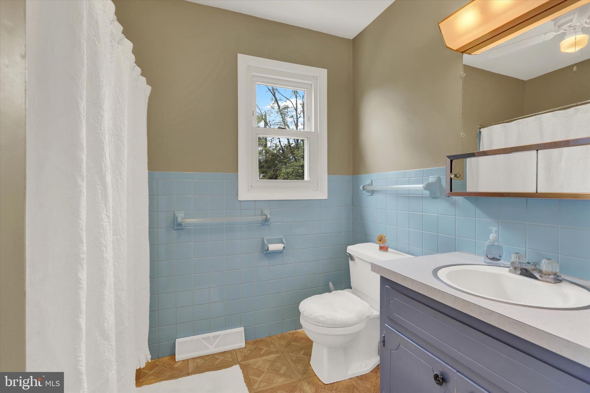 2441 River Road Middletown, PA 17057 - Photo 6 of 20 a bathroom with a granite countertop sink toilet and mirror