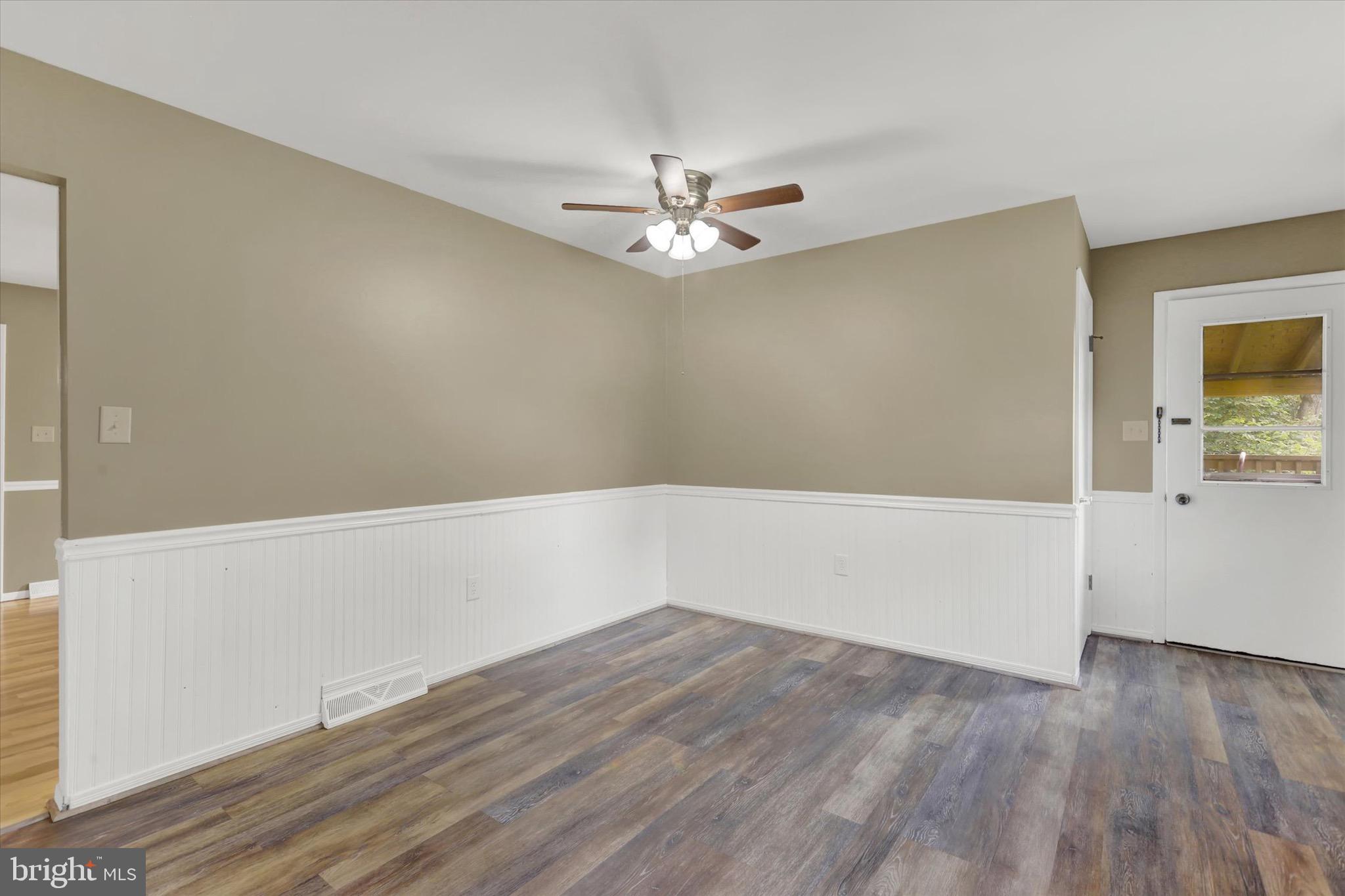 2441 River Road Middletown, PA 17057 - Photo 8 of 20 wooden floor in an empty room with a window