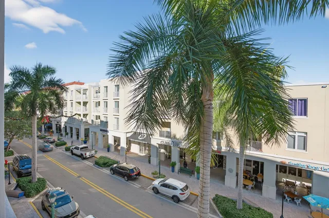 a front view of multiple houses with yard
