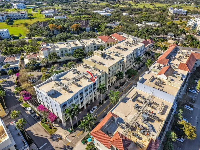 an aerial view of residential houses with outdoor space