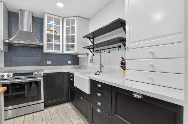 a kitchen with a stove and a sink