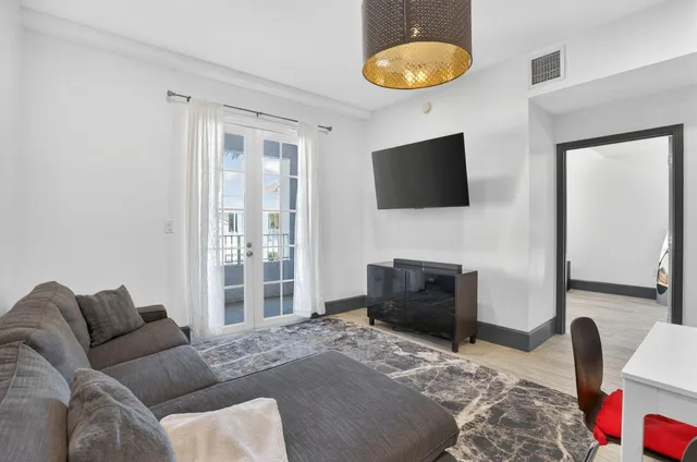 a bedroom with a bed and a television