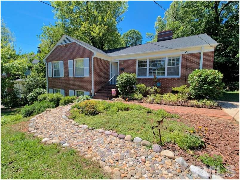 2703 Clark Avenue Raleigh, NC 27607 - Photo 1 of 24 a front view of a house with a yard