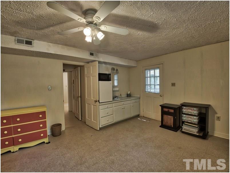 2703 Clark Avenue Raleigh, NC 27607 - Photo 15 of 24 a view of living room with furniture and windows