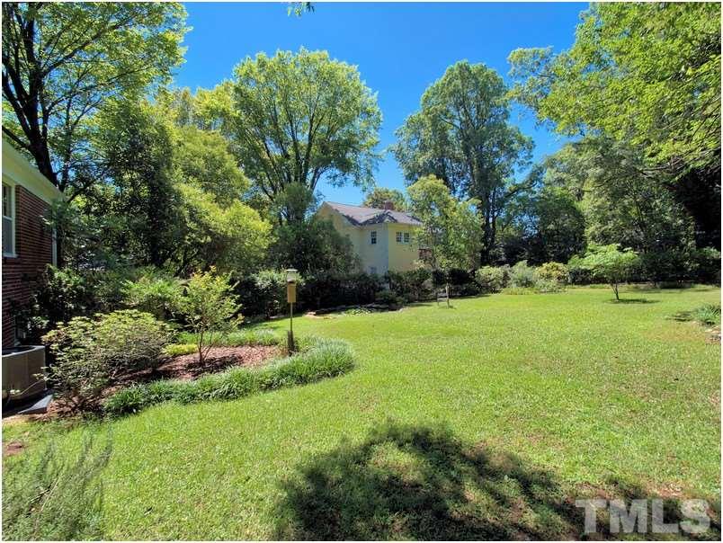2703 Clark Avenue Raleigh, NC 27607 - Photo 20 of 24 a view of a garden with a building