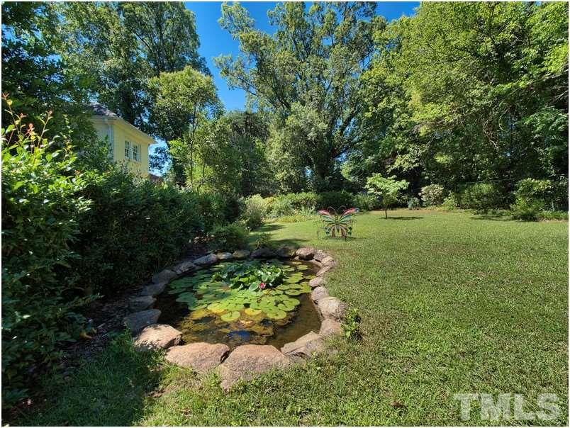 2703 Clark Avenue Raleigh, NC 27607 - Photo 21 of 24 a view of a garden with a flower