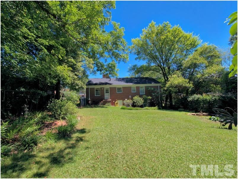 2703 Clark Avenue Raleigh, NC 27607 - Photo 22 of 24 a view of a house with a yard