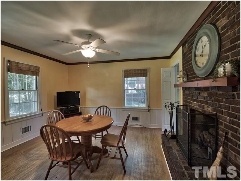2703 Clark Avenue Raleigh, NC 27607 - Photo 6 of 24 a view of a dining room with furniture window and wooden floor