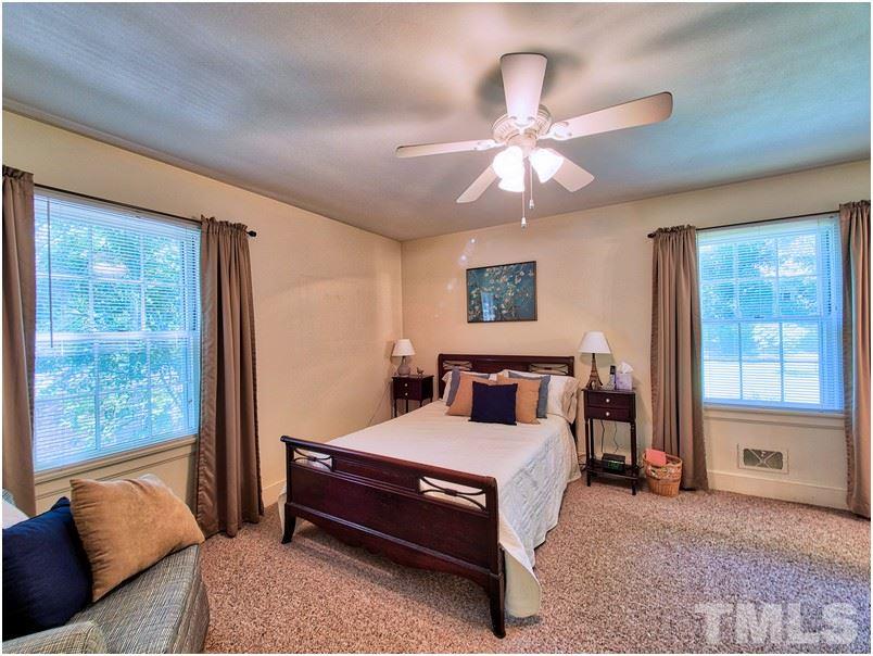 2703 Clark Avenue Raleigh, NC 27607 - Photo 9 of 24 a bedroom with furniture and a large window