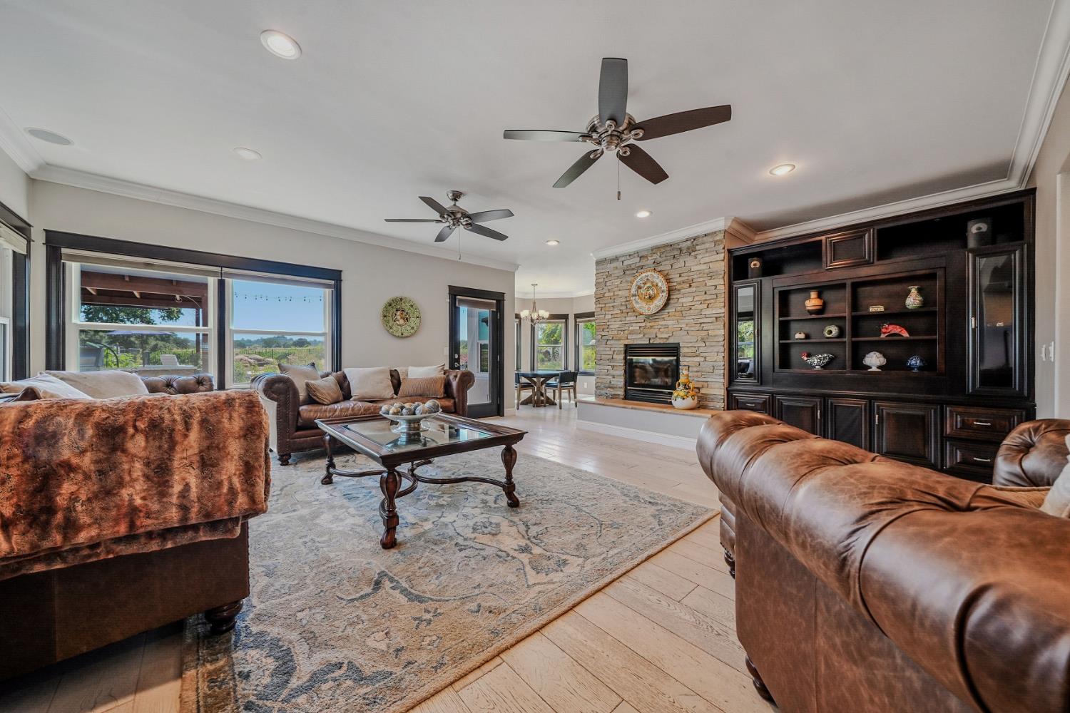 10786 Shenandoah Road Plymouth, CA 95669 - Photo 17 of 99 a living room with furniture and a fireplace