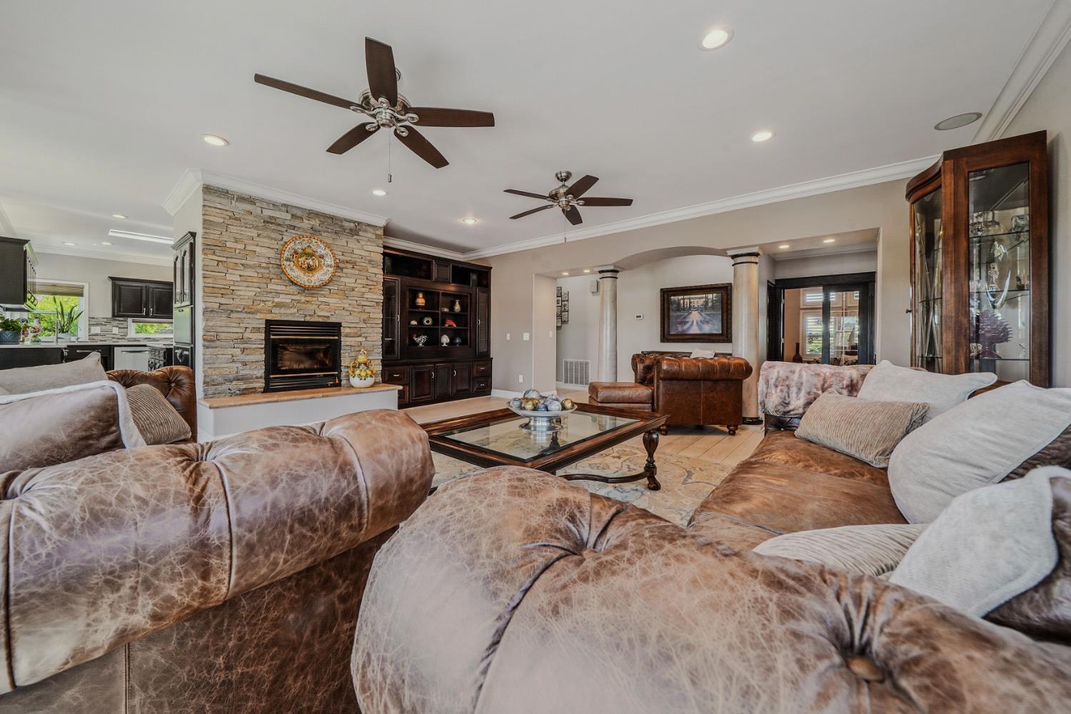 10786 Shenandoah Road Plymouth, CA 95669 - Photo 18 of 99 a living room with furniture flat screen tv and a fireplace