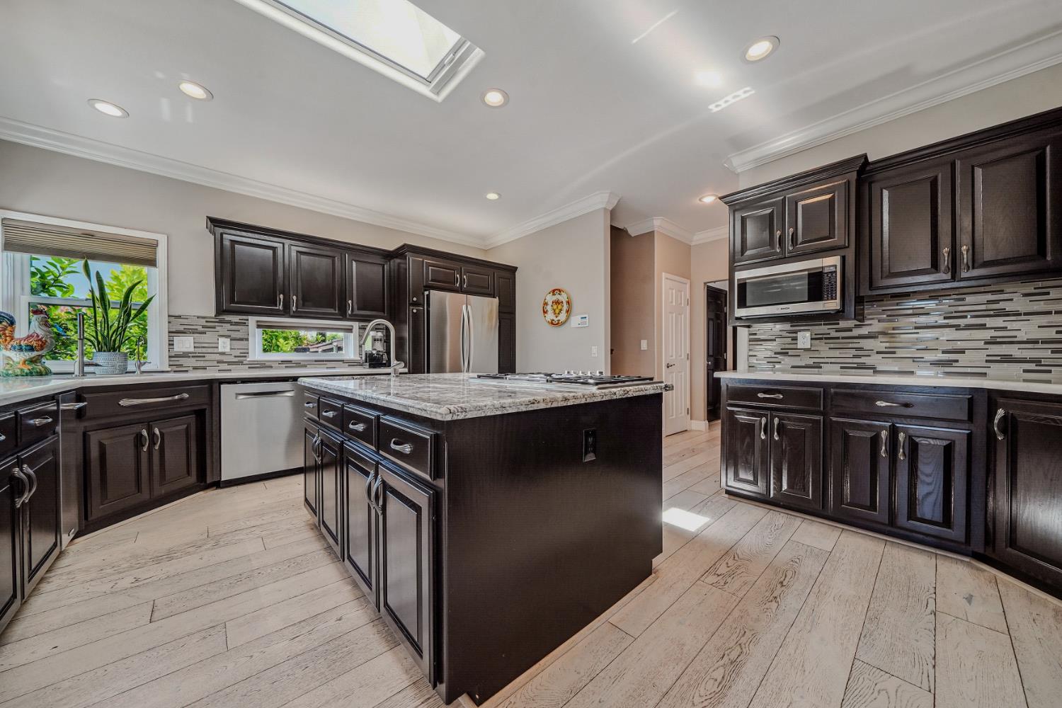 10786 Shenandoah Road Plymouth, CA 95669 - Photo 19 of 99 a kitchen with stainless steel appliances granite countertop a stove and a sink