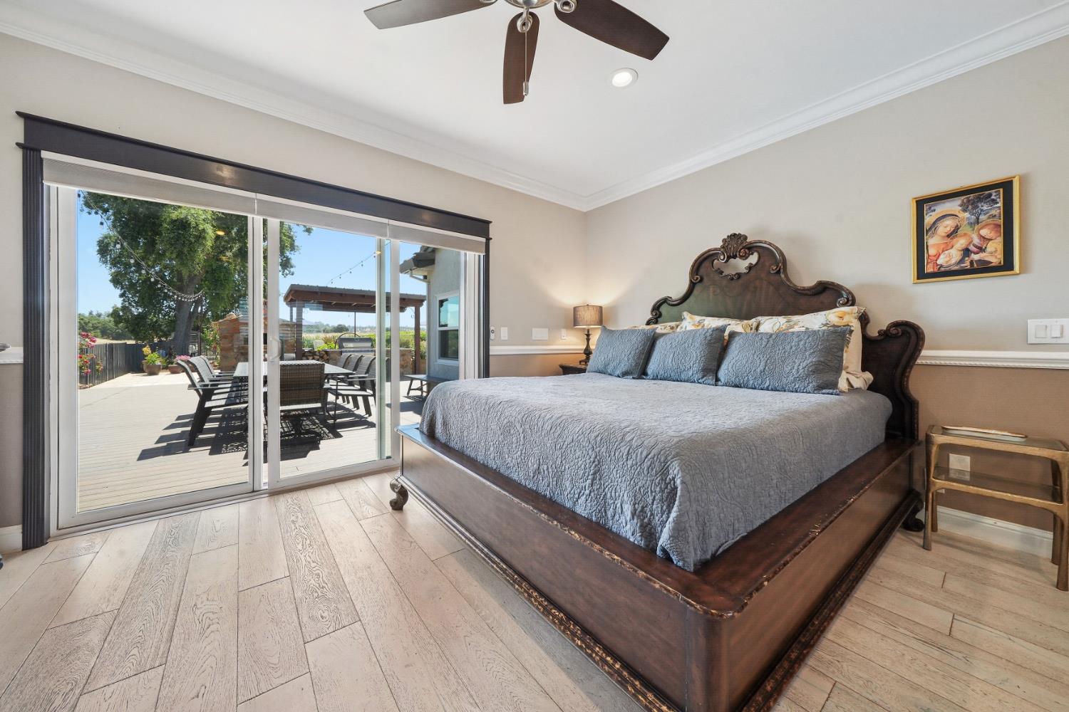 10786 Shenandoah Road Plymouth, CA 95669 - Photo 34 of 99 a large bedroom with a bed and wooden floor