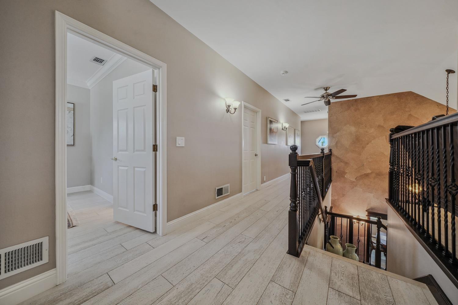 10786 Shenandoah Road Plymouth, CA 95669 - Photo 38 of 80 a view of a hallway with furniture and wooden floor