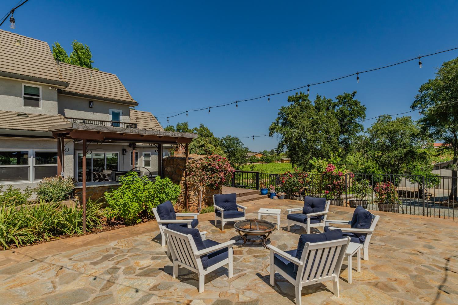10786 Shenandoah Road Plymouth, CA 95669 - Photo 51 of 80 a view of a patio with table and chairs and potted plants