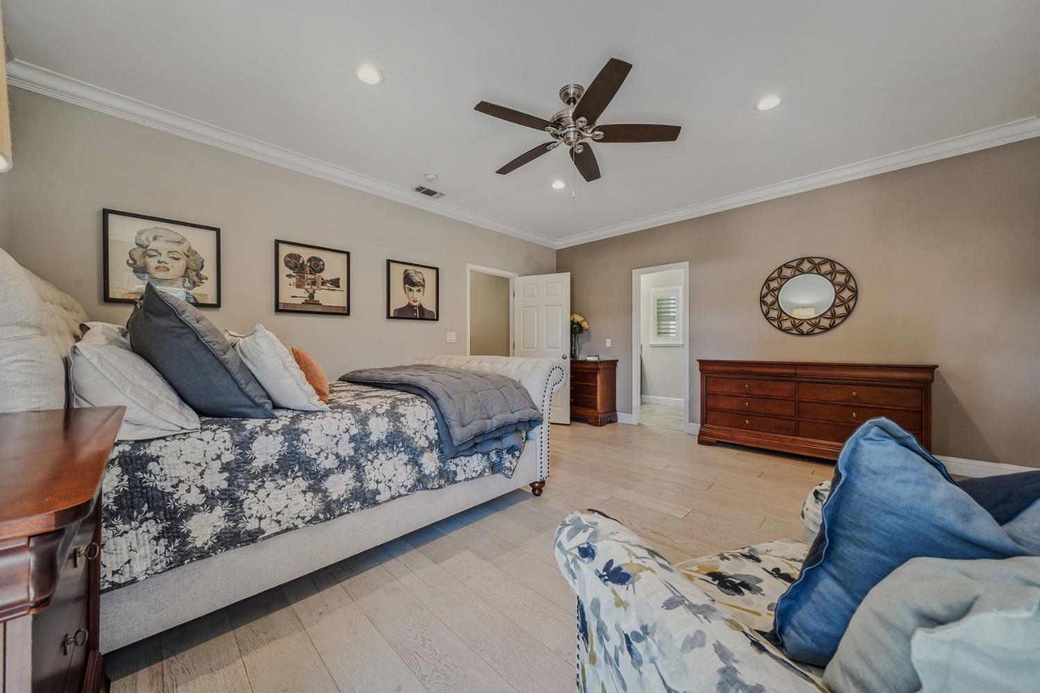 10786 Shenandoah Road Plymouth, CA 95669 - Photo 55 of 99 a spacious bedroom with a bed and painting on the wall