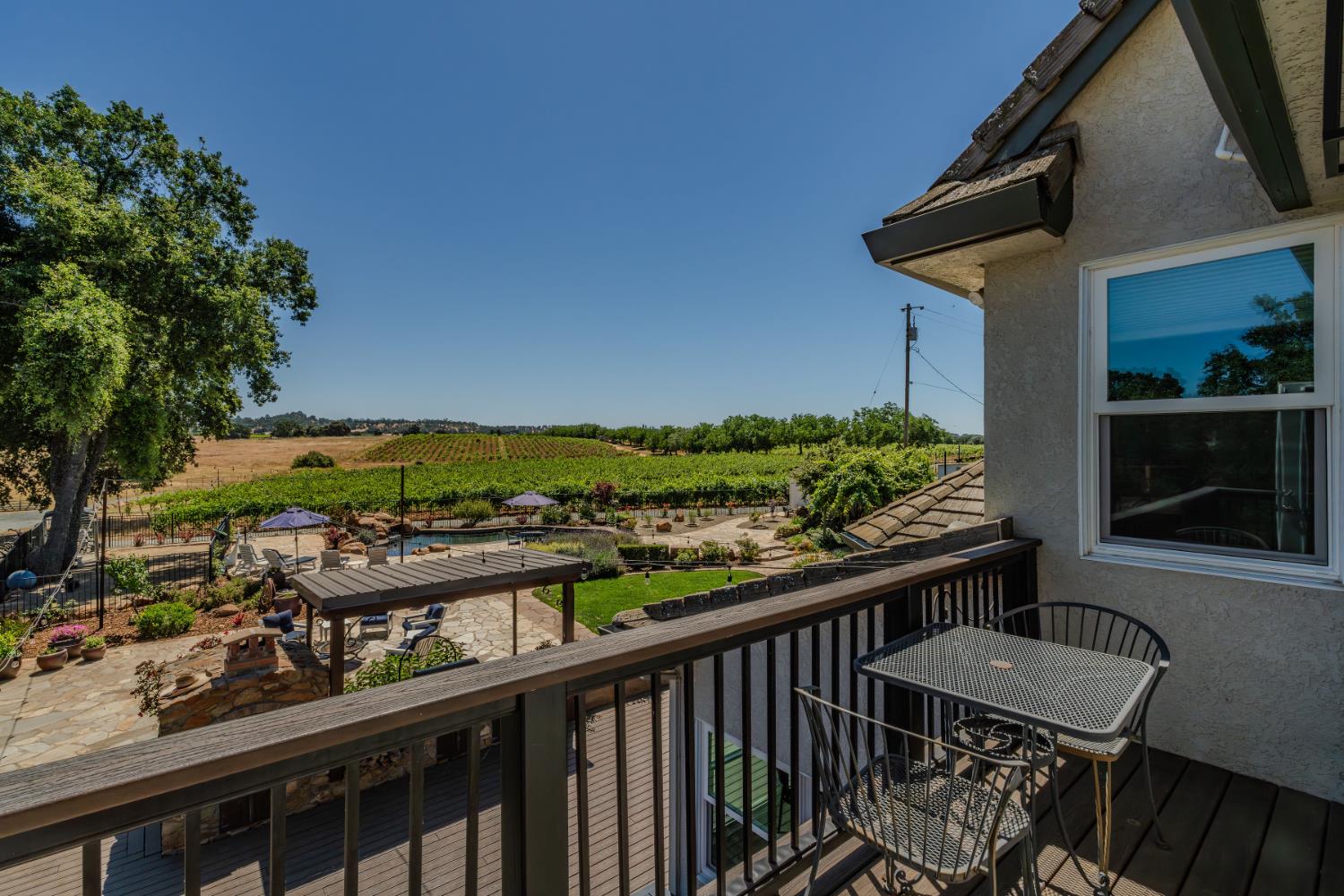 10786 Shenandoah Road Plymouth, CA 95669 - Photo 56 of 99 a view of a balcony with wooden floor and outdoor seating