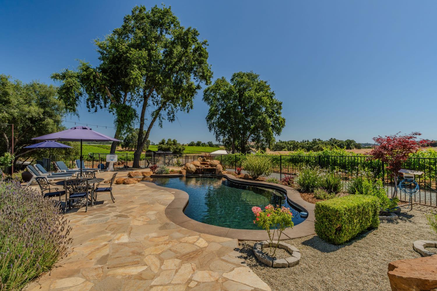 10786 Shenandoah Road Plymouth, CA 95669 - Photo 67 of 99 an outdoor space with patio and white umbrellas