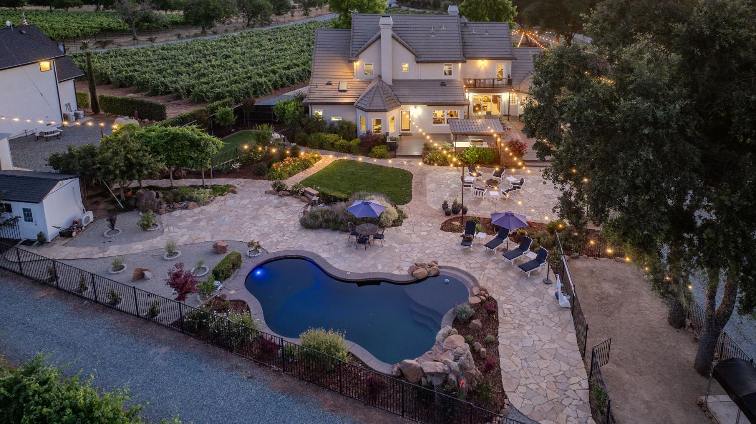 10786 Shenandoah Road Plymouth, CA 95669 - Photo 97 of 99 an aerial view of a house with a yard and lake view