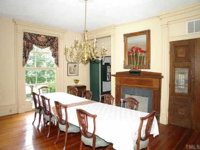 4840 Solomon Lea Road Leasburg, NC 27291 - Photo 4 of 10 a view of a dining room with furniture window and wooden floor