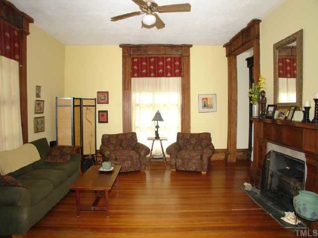 4840 Solomon Lea Road Leasburg, NC 27291 - Photo 5 of 10 a living room with furniture and a fireplace