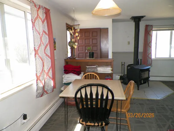 a view of a dining room with furniture window and outside view