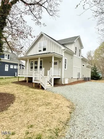 a house that has a tree in front of it