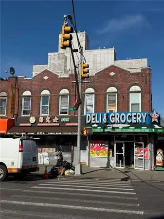 a front view of a building with retail shops