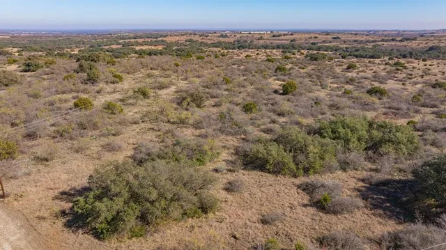 an aerial view of a house with a city view