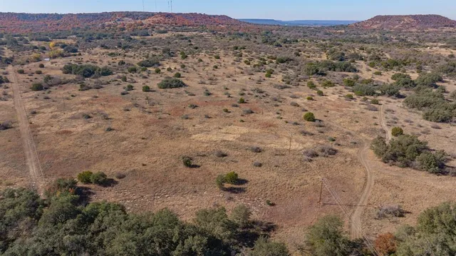 a view of a city with mountains in the background