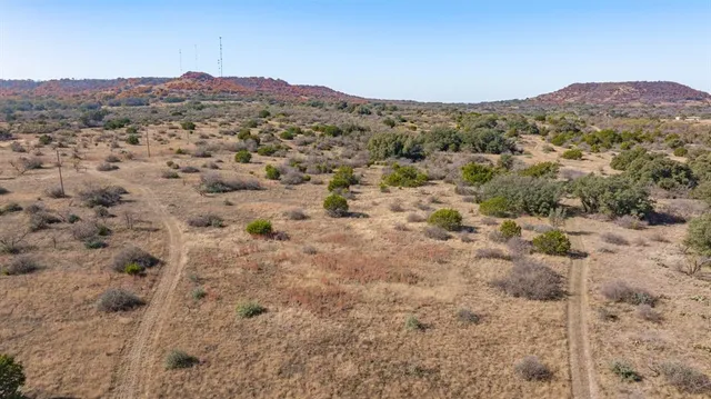 a view of a city with mountains in the background