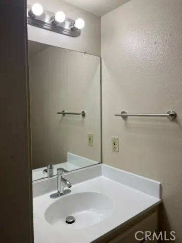 a bathroom with a sink a toilet and a shower