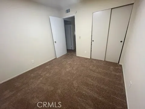 a view of a hallway with staircase