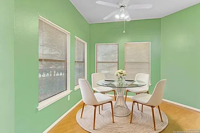 a view of a dining room with furniture and wooden floor