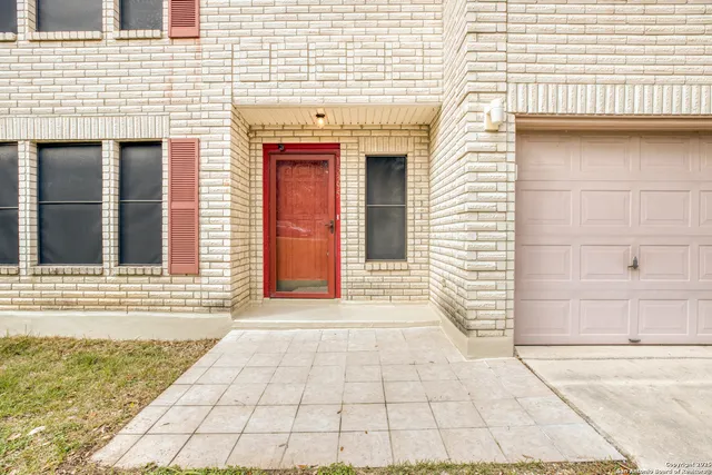 a view of a brick house with white door