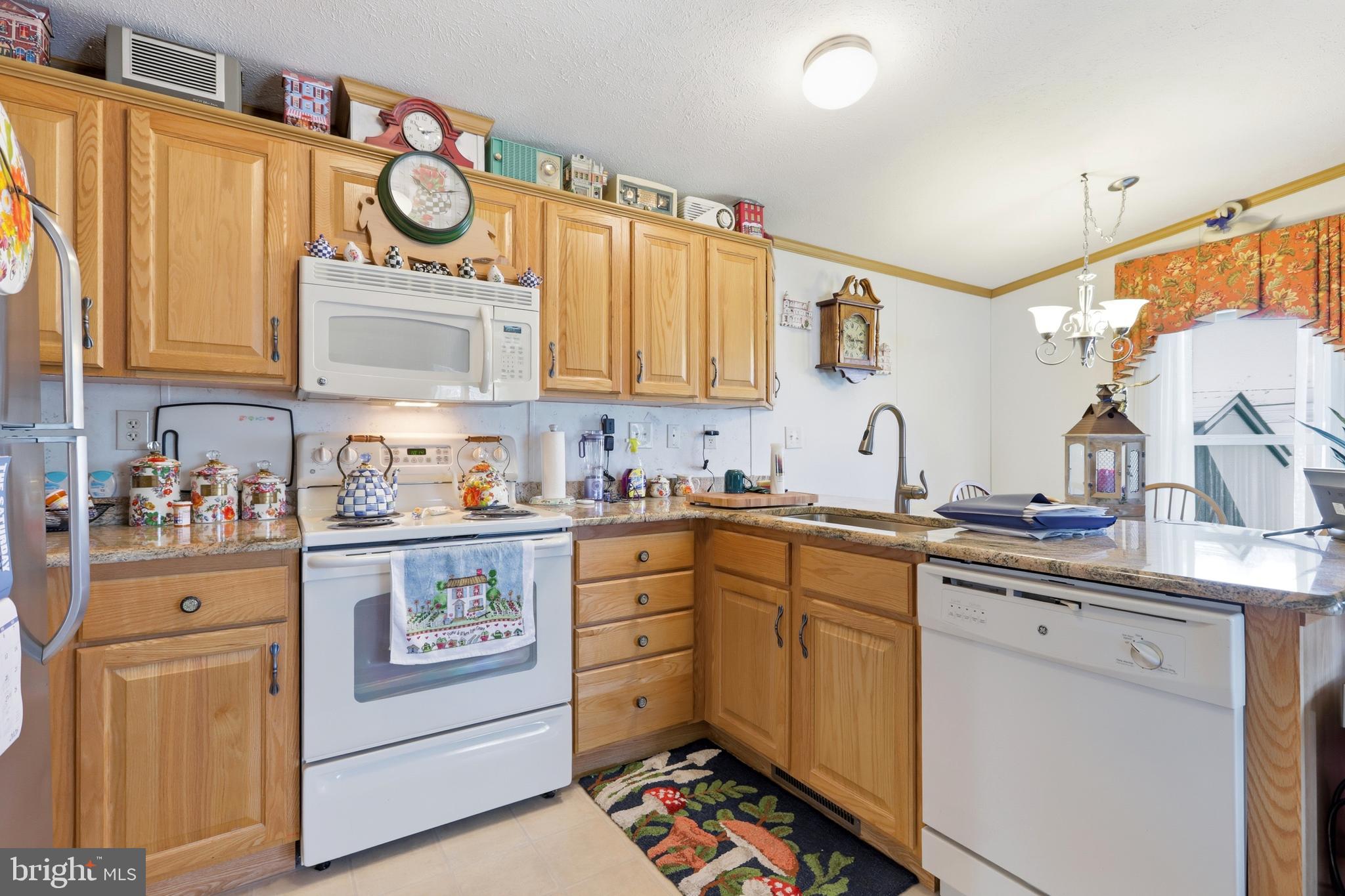 69 1st Avenue Media, PA 19063 - Photo 6 of 17 a kitchen with stainless steel appliances granite countertop a stove and cabinets