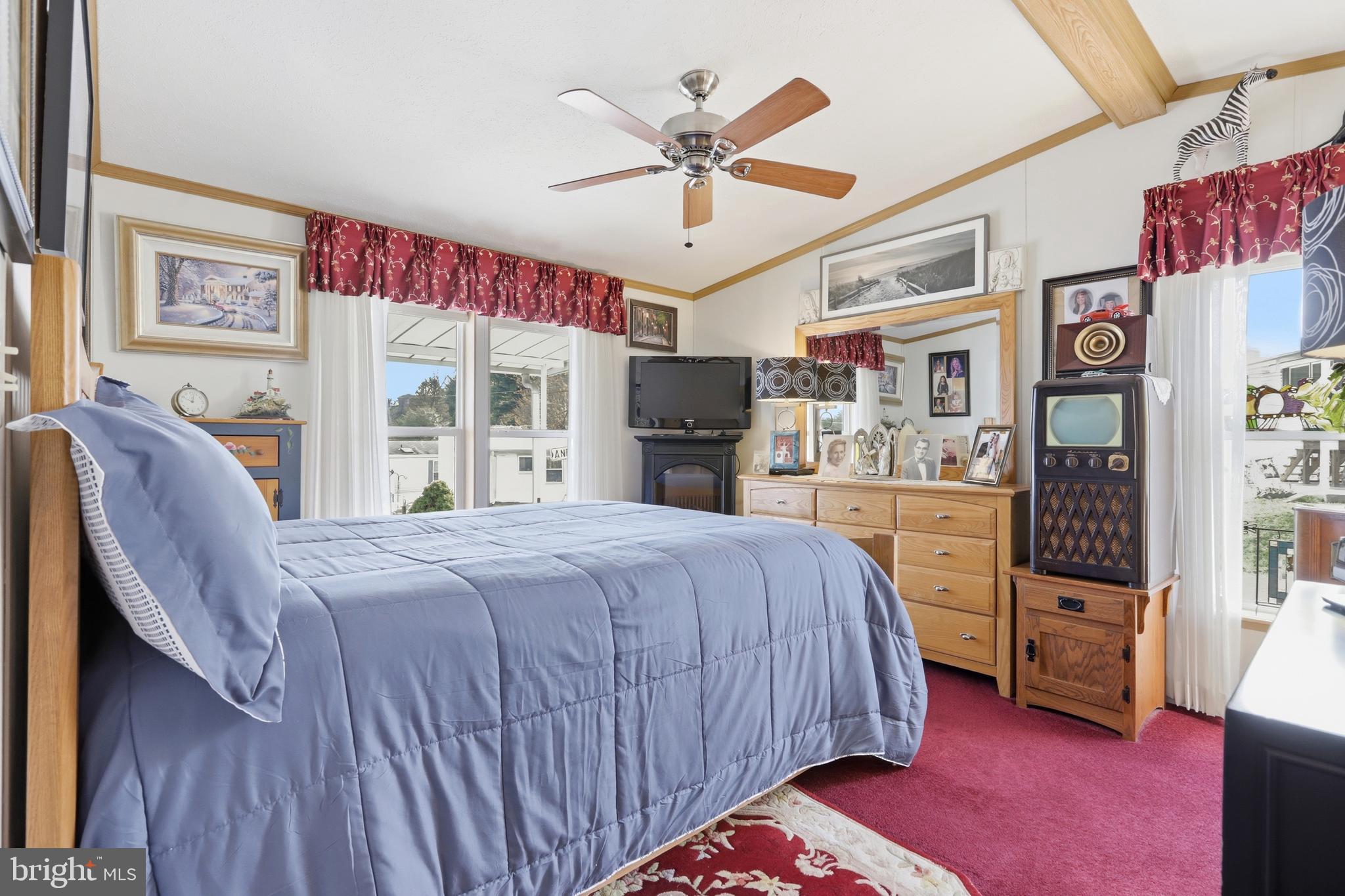 69 1st Avenue Media, PA 19063 - Photo 10 of 17 a bedroom with a bed dresser and a large window